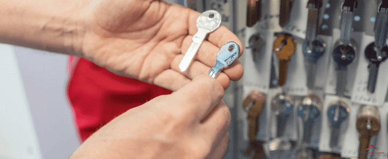 Locksmith with key blanks on his hand.